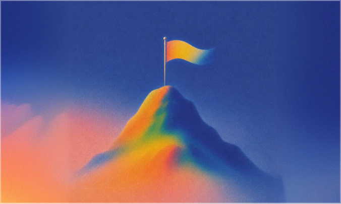 A flag planted on a mountain summit